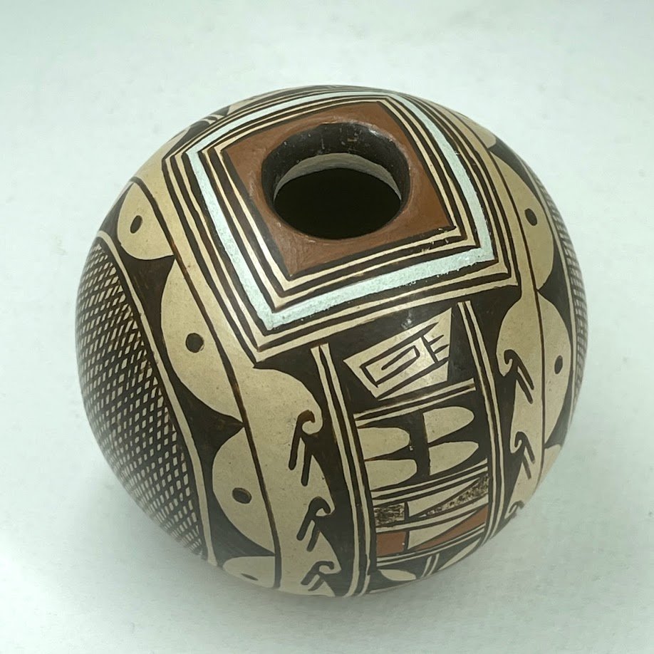 Zuni Spirits is proud to represent a variety of Zuni fetish carvers, including Cynthia R. Sequi Komalestewa, Hopi, (1955-1995), Potter, Hopi!