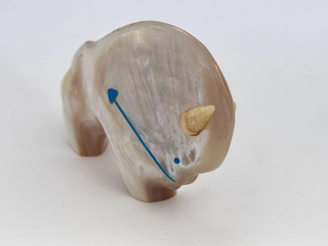 Zuni Spirits is proud to represent a variety of Zuni fetish carvers, including Lynn Quam|Mother of Pearl/Fossil Ivory Buffalo!